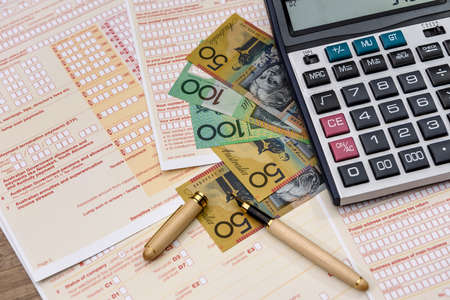 Australian tax form with calculator and australian dollarsの写真素材