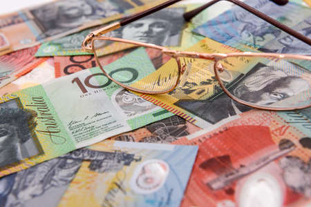 Australian dollar banknotes with glasses close up