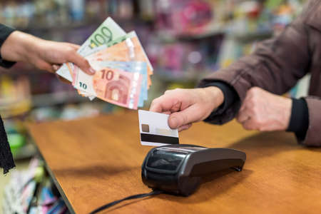 Payment with credit card in toys shop, closeupの写真素材