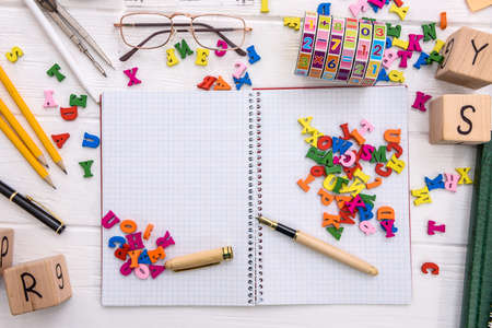 Colorful letters on blank notepad on light backgroundの写真素材