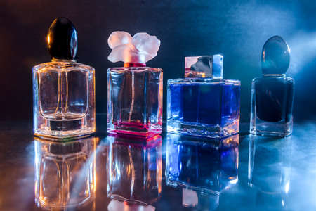 Perfumes in bottles on dark background close upの写真素材