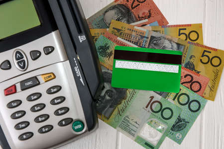 Banking terminal with credit card and australian dollarsの写真素材