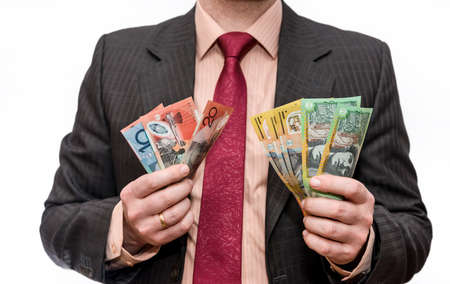 Man holding australian dollar banknotes close upの写真素材