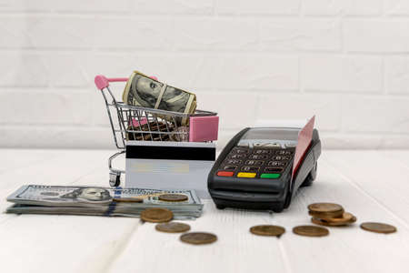 Toy cart with dollar, credit card and banking terminal