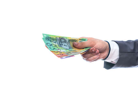 Male hand with australian dollars isolated on white