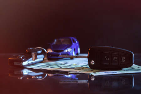 Euro banknotes on dark background with keysの写真素材
