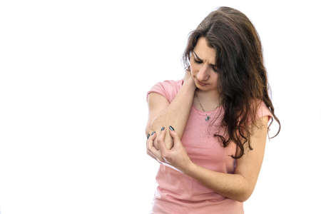 Woman with pain in elbow isolated on white background