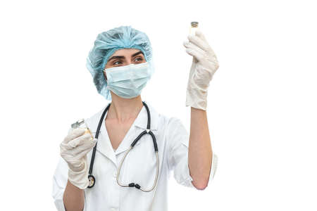 Doctor in uniform holding ampoules isolated on whiteの写真素材