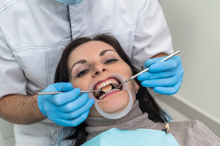 Doctor making treatment procedures in dentistry close upの写真素材