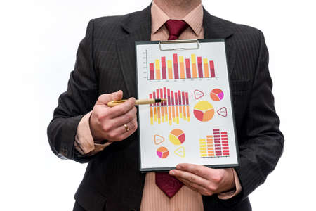 Man in suit with business graphs on clipboard isolatedの写真素材