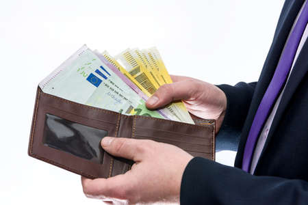 Male hands with wallet isolated on whiteの写真素材