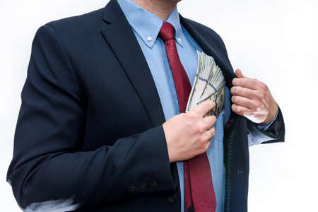Man in suit holding dollar banknotes isolated on white