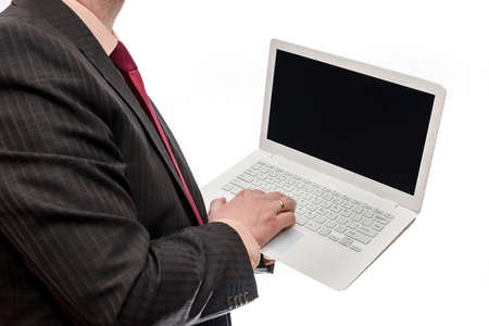 Man in suit holding laptop on white backgroundの写真素材