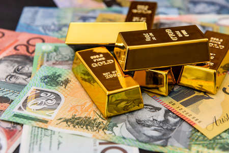 Australian dollars with gold ingots close upの写真素材