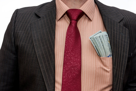 Male hands with dollar banknotes in pocketの写真素材