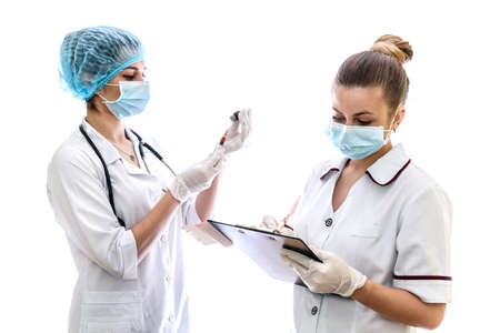 Doctor and nurse preparing injection isolated on white