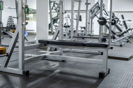 Modern interior of light gym with different equipment