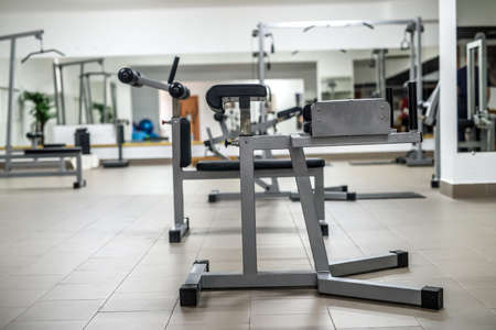 Different color weights for barbells in gymの写真素材