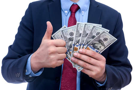 Businessman holding american dollars in fan isolated on whiteの写真素材