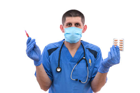 young male doctor examining syringe with blood of the patient isolated on white background.