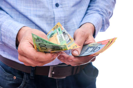 Male hands counting australian dollar banknotes close upの写真素材