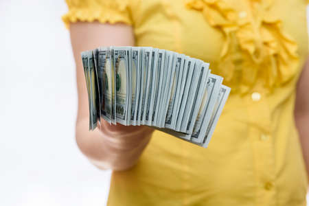 Female hands with american dollar banknotes close upの写真素材