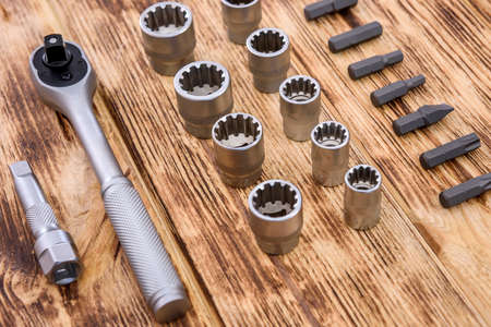 Mechanical tools on wooden table close up
