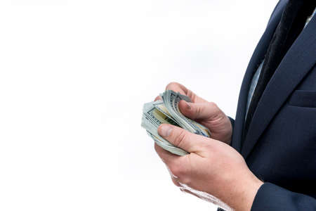 Male hands counting dollar banknotes isolated on white