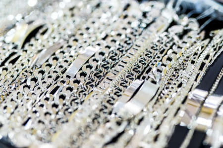 Jewelery showcase with silver chainlets close up