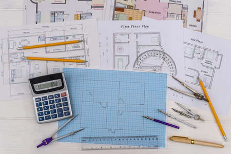 Architectural sketch of house on millimeter paper with toolsの写真素材