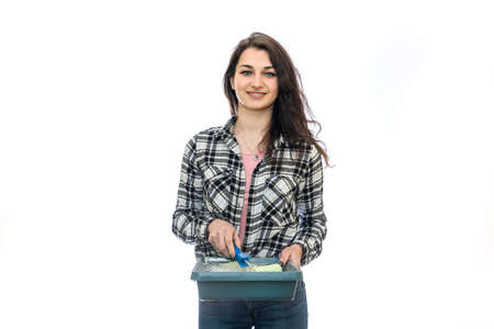 Woman with painting tray isolated on white