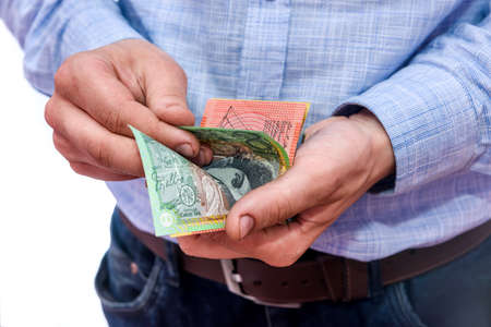 Male hands counting australian dollar banknotes close upの写真素材