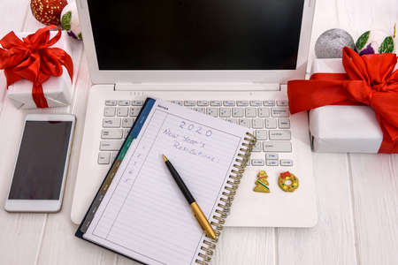 Notepad with new year presents and decorations