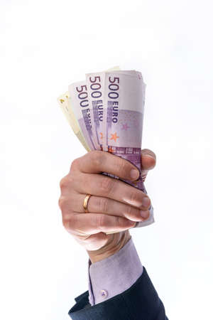 Man hand hold or given money isolated on white background. Euro currency with 500 and 200 euro bank...