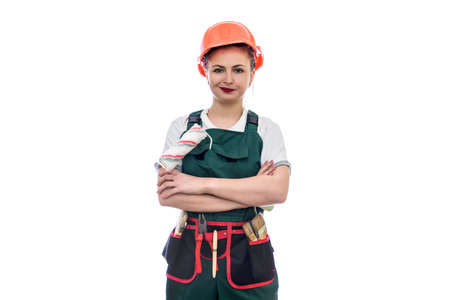 Young woman in helmet holding roller isolated on whiteの写真素材