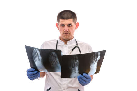 attractive doctor holding an foot x-ray. Examining X-ray.の写真素材