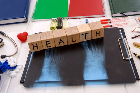 X-ray with pills and notepads on table