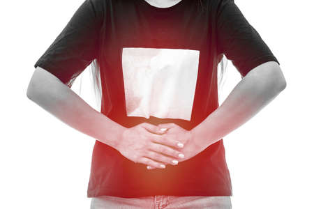 Pain concept. Female hands on side of belly