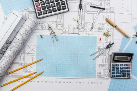 Technical drawing, graph paper and tools. Engineer office team working with blueprints.