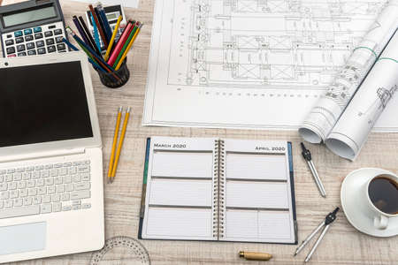 Workplace of engineer. Top view of laptop, notepad, and drawing tools