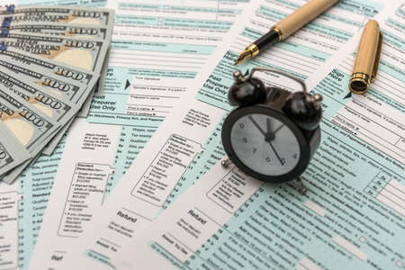 US tax form with moneyの写真素材