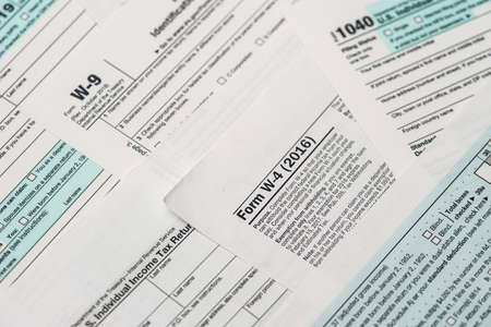 Paper blanks of 1040, w4 and w9 tax form close upの写真素材