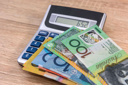 Australian money aud with calculator on desk.の写真素材