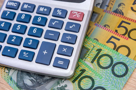 Australian money aud with calculator on desk.の写真素材