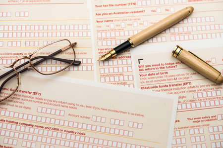 Australian tax declaration and pen on wooden table