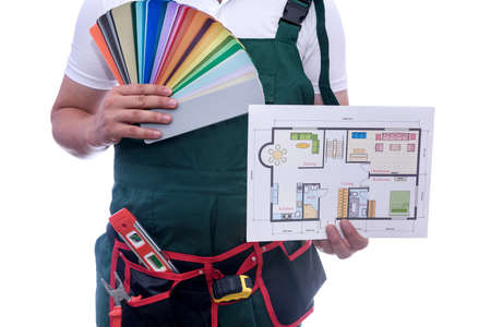 Man with color swatch and house plan isolated on whiteの写真素材
