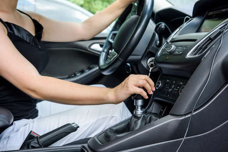 Woman driving car with steering wheel. Female driver inside carの写真素材