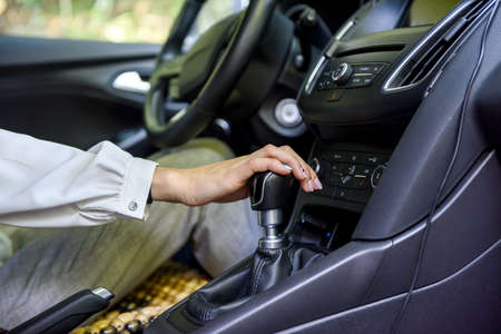 Woman driving car with steering wheel. Female driver inside carの写真素材