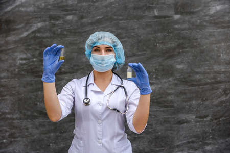 the nurse examines the contents of the medication vial. medical conceptの写真素材