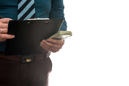 businessman signs purchase or lease agreement, holding dollars on isolated white background